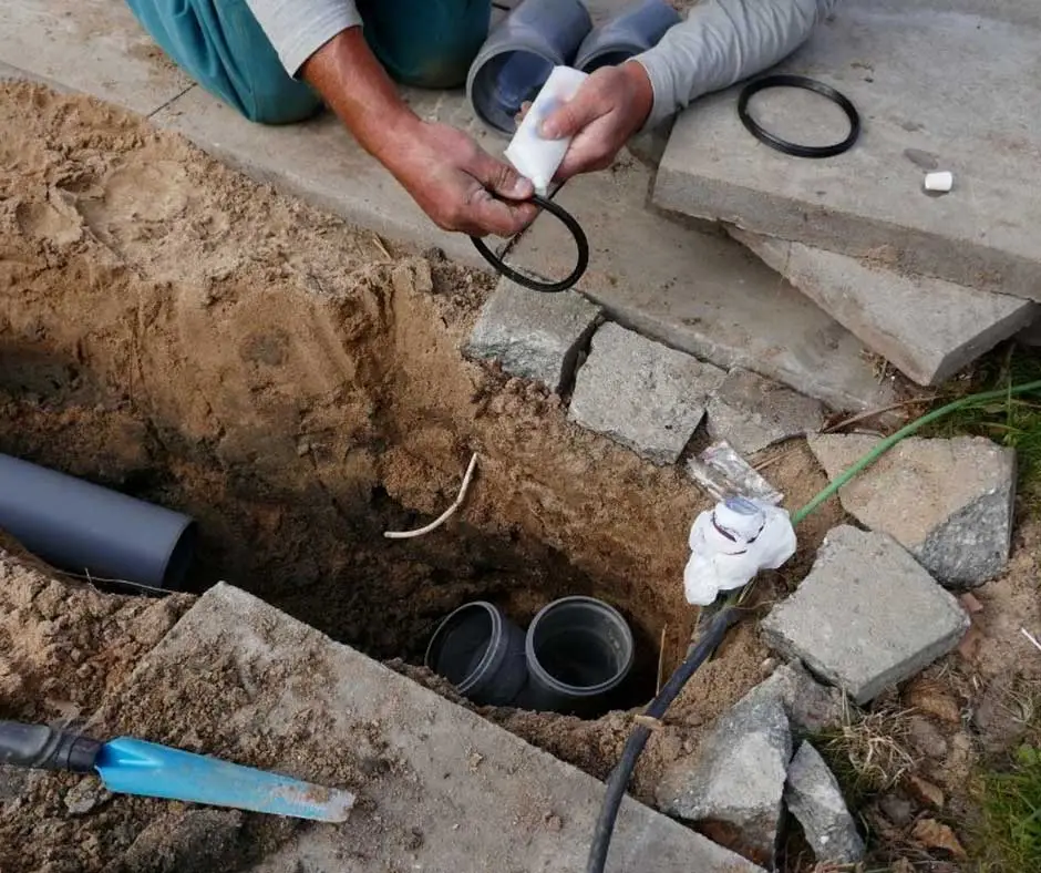 Hands assembling French Drain Installation Philadelphia, PA