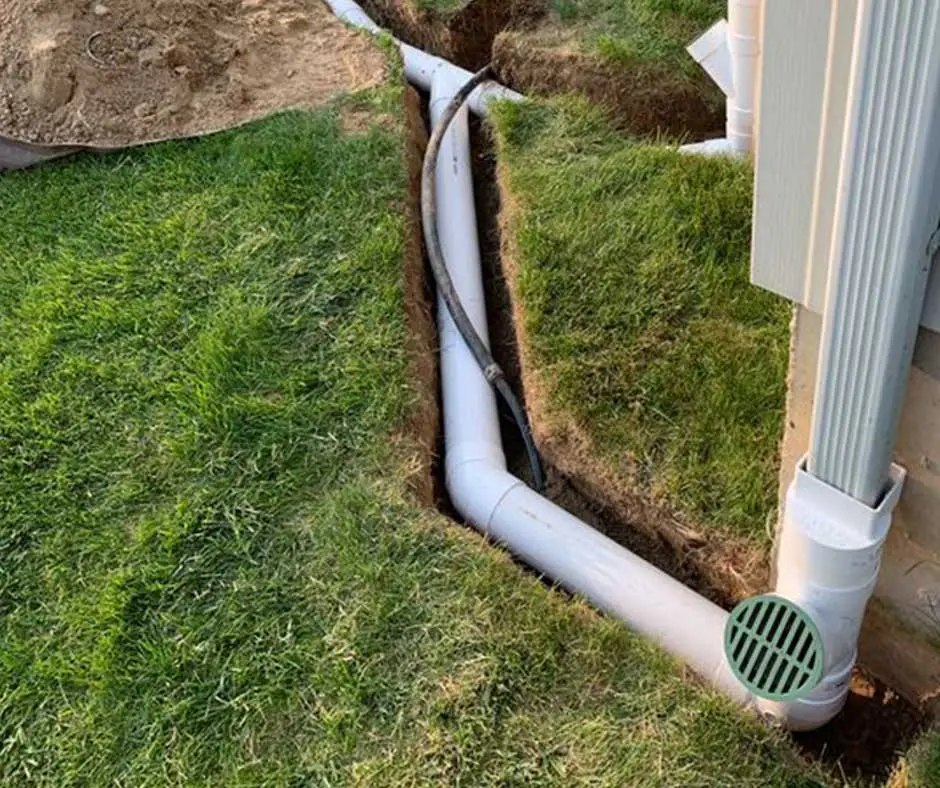 White drainage pipes connected Sump Pump Installation Philadelphia, PA